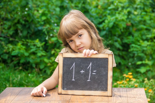 Child student with a red apple Selective focus