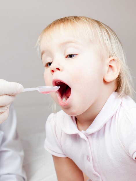 Child taking a medicine