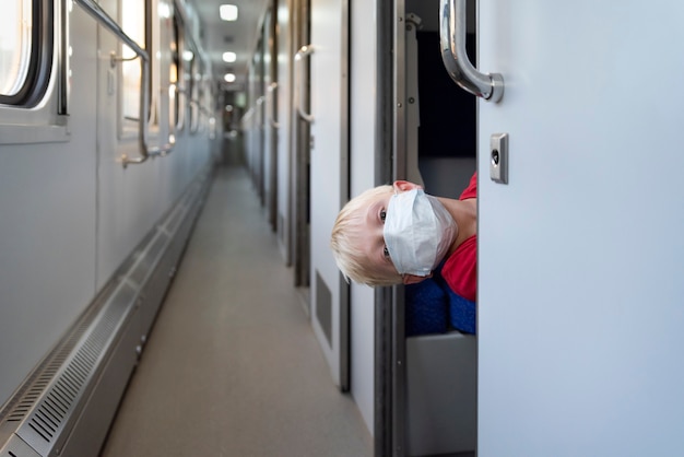 Child traveling by train during the pandemic