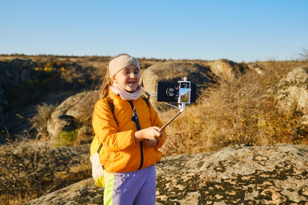 Child vlogger filming daily video diary outdoors kid creating social media content