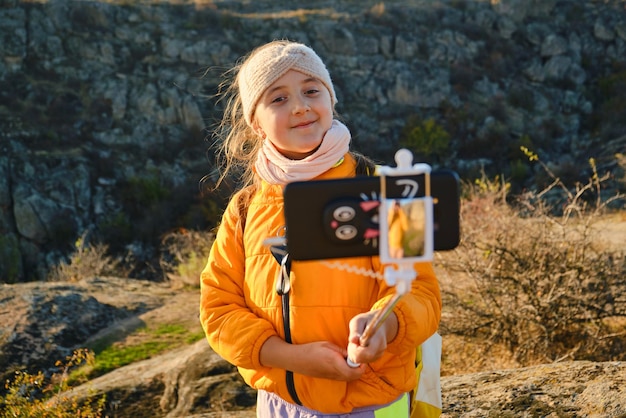 Child vlogger filming daily video diary outdoors kid creating social media content