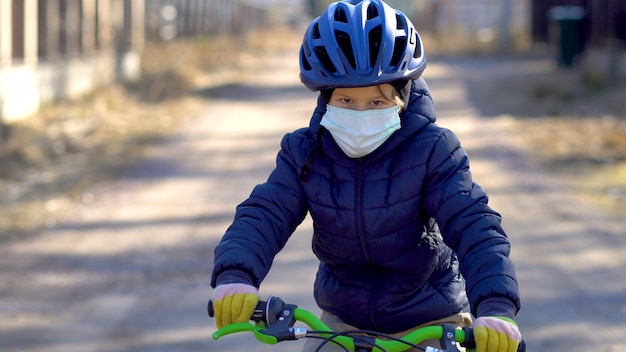 A child on a walk during the quarantine period of the coronavirus Covid19.