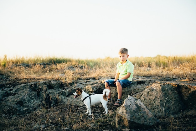 Child walking with a pet dog