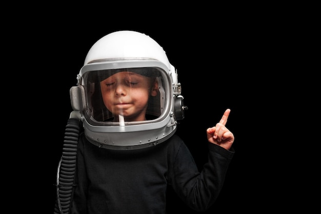 Child wants to fly an airplane wearing an airplane helmet