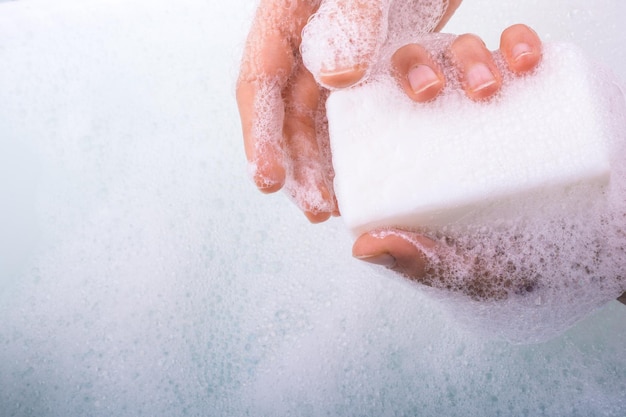 Child washing hands with soap