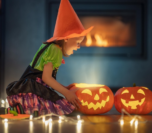 Child with carving pumpkin