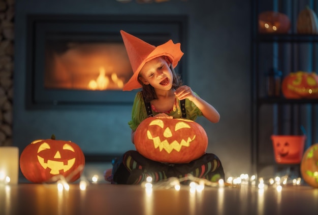 Child with carving pumpkin