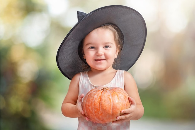 Child with halloween pumpkin isolated