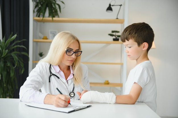 A child with a plaster on his hand at clinic