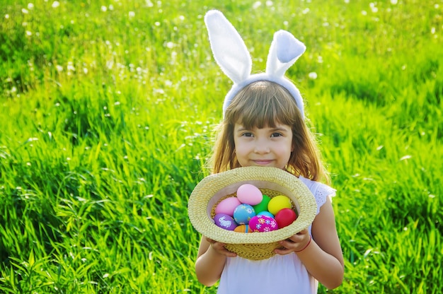 Child with rabbit ears. Easter. Selective focus.