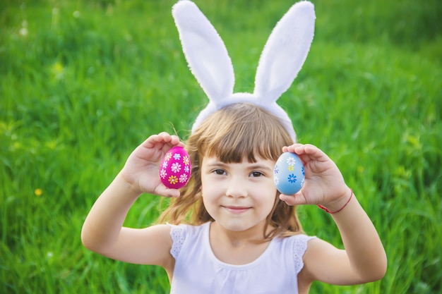 Child with rabbit ears. Easter. Selective focus.