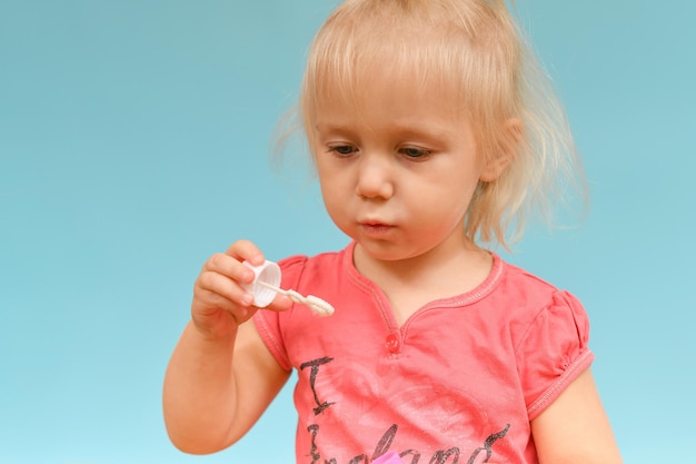 A child with soap bubbles is having fun on his holiday