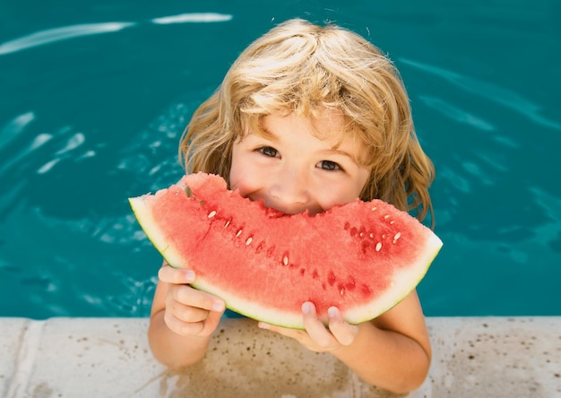 Child with watermelon in swimming pool Kids eat summer fruit outdoors Banner for header copy space Poster for web design