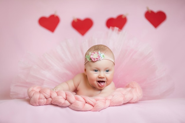 Childhood care motherhood health medicine pediatrics concepts Close up Little peace calm naked infant newborn baby girl in pink hat sleeps resting take deep nap laying on tummy on soft bed