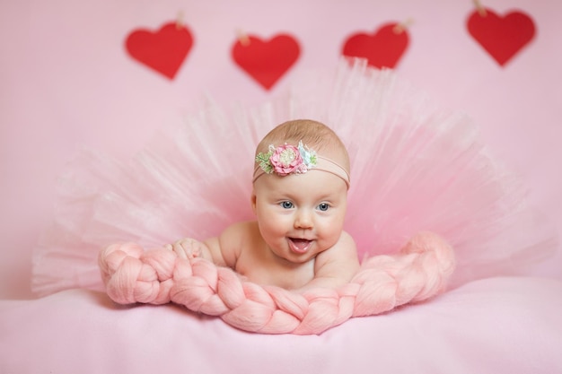 Childhood care motherhood health medicine pediatrics concepts Close up Little peace calm naked infant newborn baby girl in pink hat sleeps resting take deep nap laying on tummy on soft bed