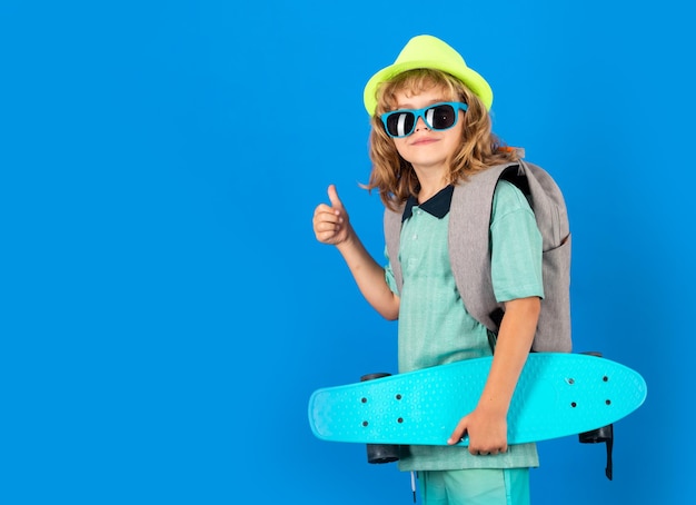 Childhood Cute child with skateboard on color isoalted background Funny kid boy stylish skater