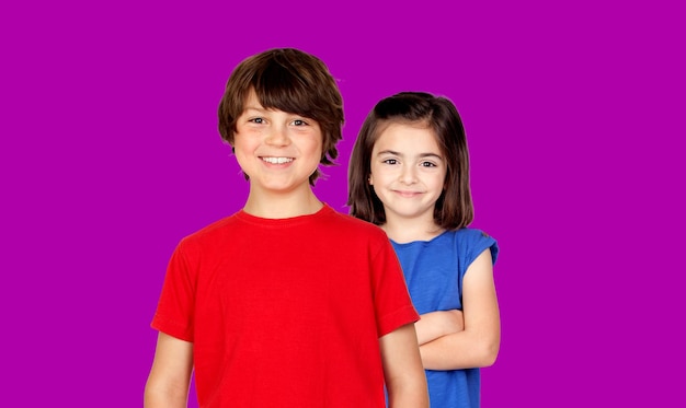 Childhood fashion and people concept happy smiling boy and girl looking at camera