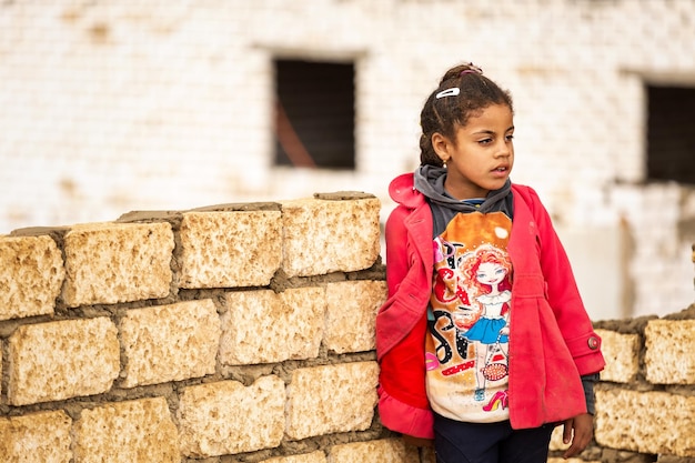 Children of Africa. Portrait of a young girl from Egypt. Street portrait.