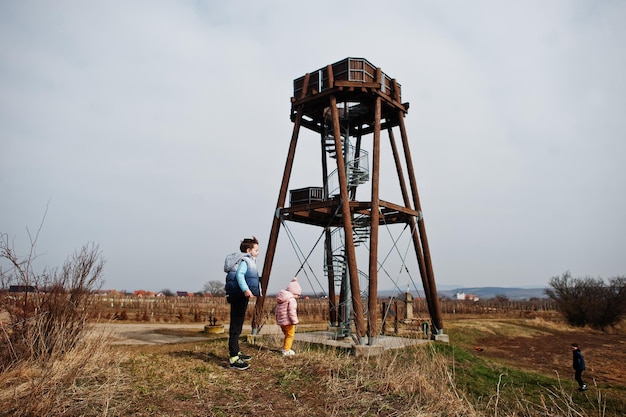 Children against wooden observation tower