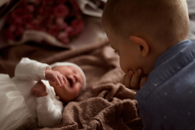 the children are at home. a boy and a girl.brother and sister on the bed.