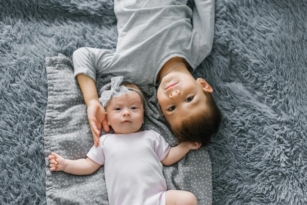 Children brother and sister in positions top view