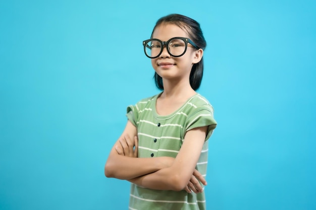 Children close up photo of cute and cheerful people, wearing glasses looking and smile on blue paste