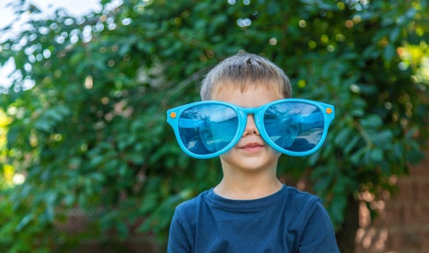 Children enjoy nature in glasses Selective focus