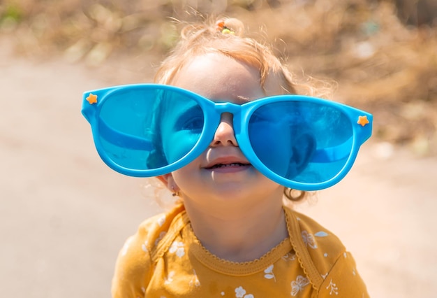 Children enjoy nature in glasses Selective focus