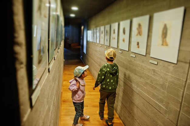 Children exploring expositions in museum halls