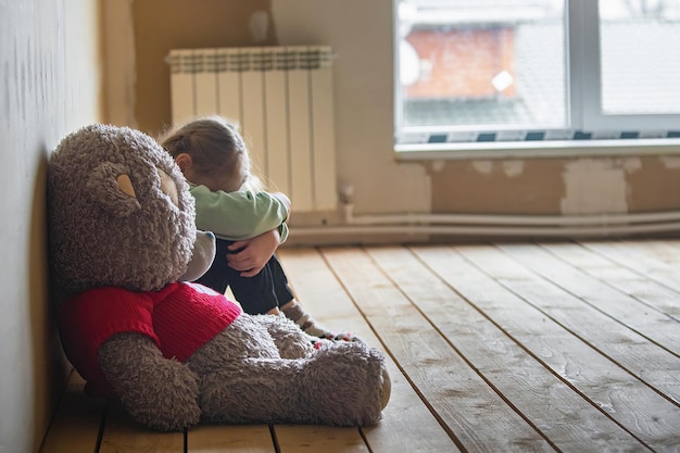 children in frustration in sadness at home with a toy