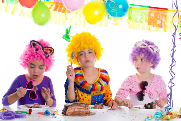 Children happy birthday party eating chocolate cake