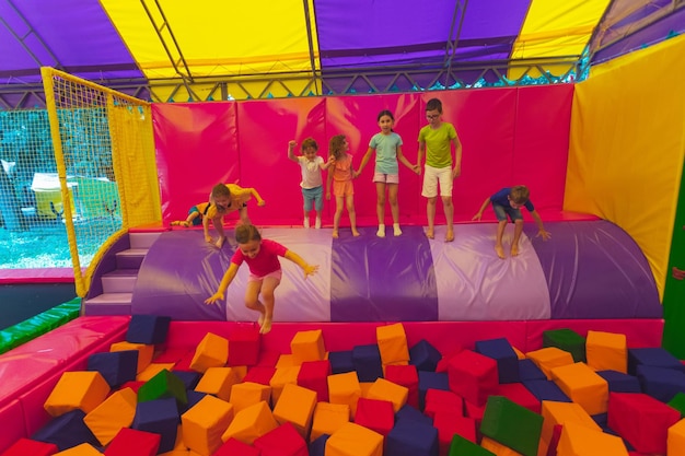 The children have a great time together in the trampoline park