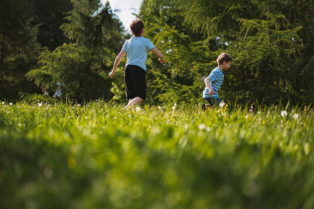 Children having fun running in park