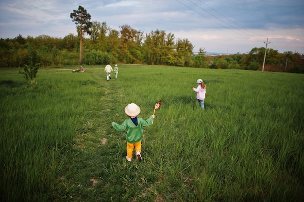 Children having fun together at meadow