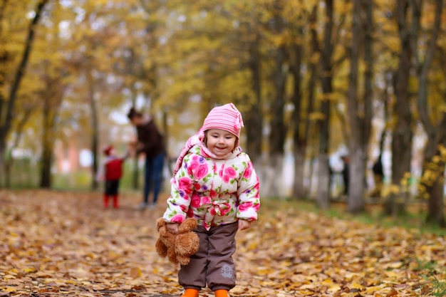 Children having fun on a walk in the autumn park