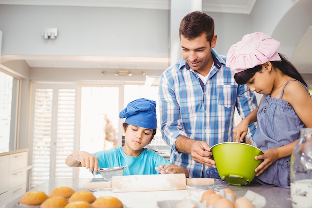 Children helping father in preparing food