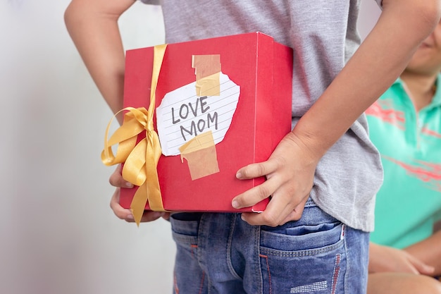 Children and homemade gifts to surprise mom