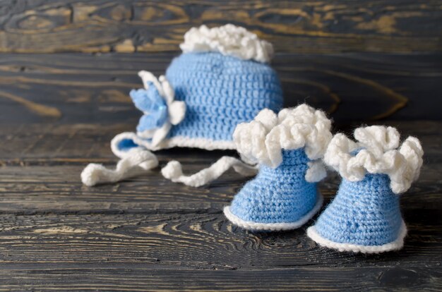 Children knitted garments for the boy. Hat and booties