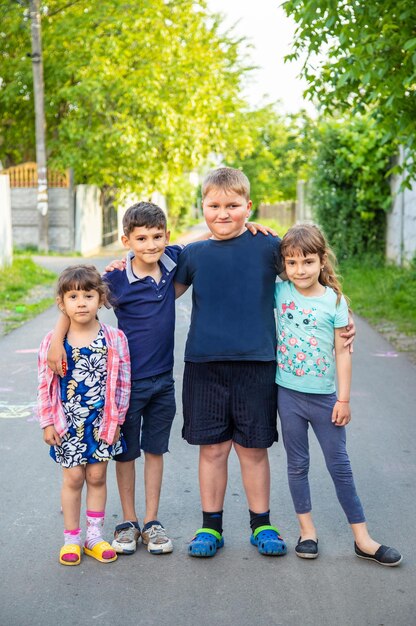 Children, many friends, games Selective focus summer