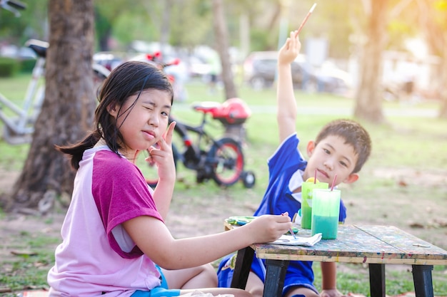 Children painting in park