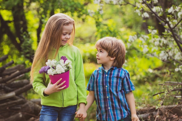 Children planting Active family leisure with kids Springtime or summertime for kids on the ranch