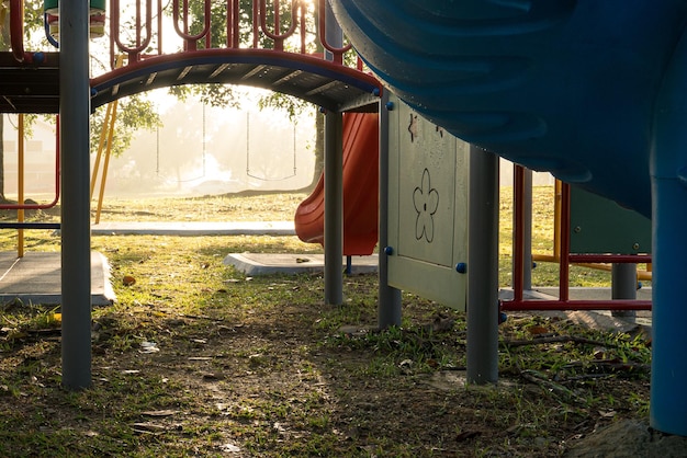 Children playground in the park with morning sunlight