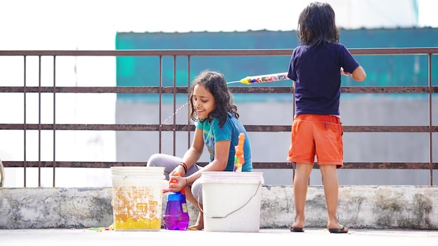 Children playing holy with her sister and enjoying