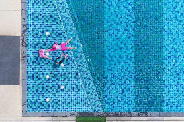 Children playing in the pool, Aerial top view