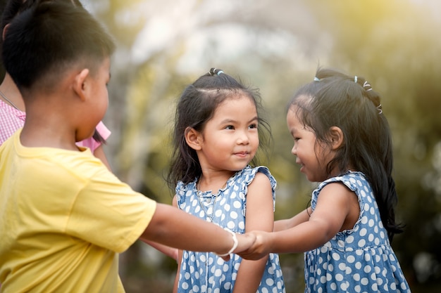 Children playing together in the park in vintage color tone