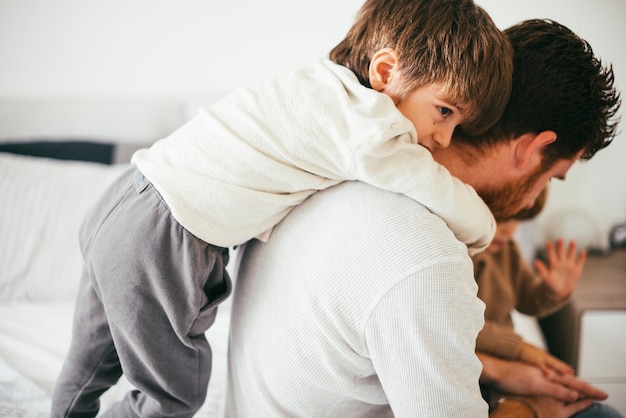 Children playing with father