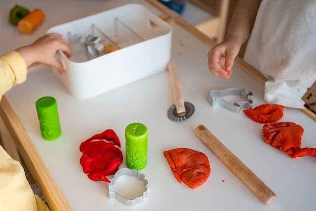 Children playing with plasticine sensory development and experiences themed activities with children