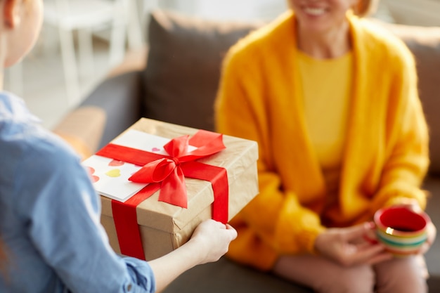 Children Presenting Gift for Mom