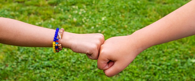 The children put their hands together Selective focus