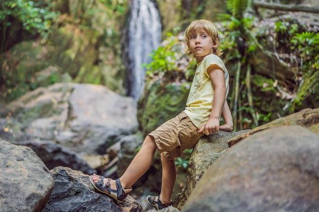 Children rest during a hike in the woods